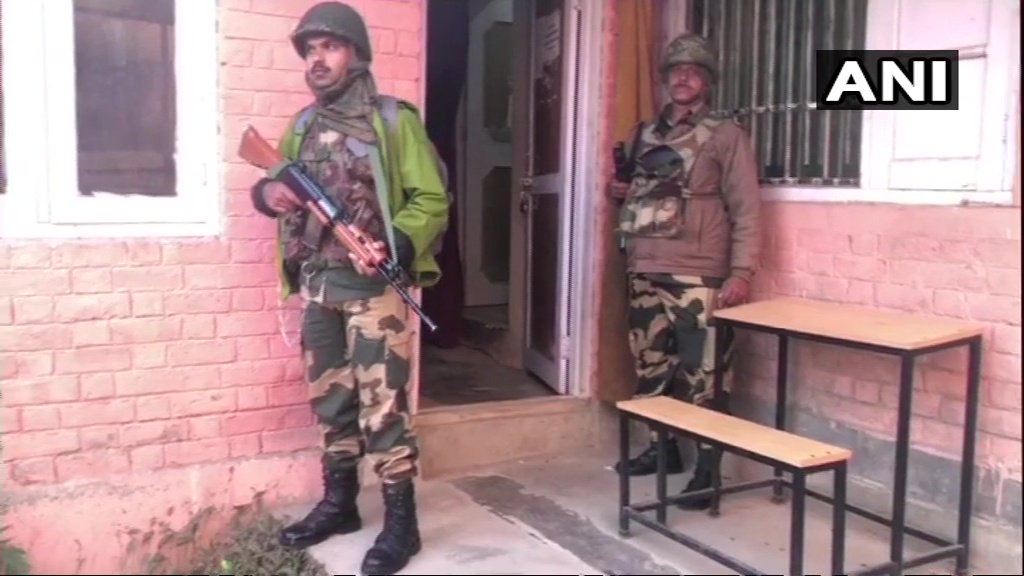 Jammu And Kashmir: Heavy security deployed at a polling booth in Baramulla as voting for local body elections is underway   