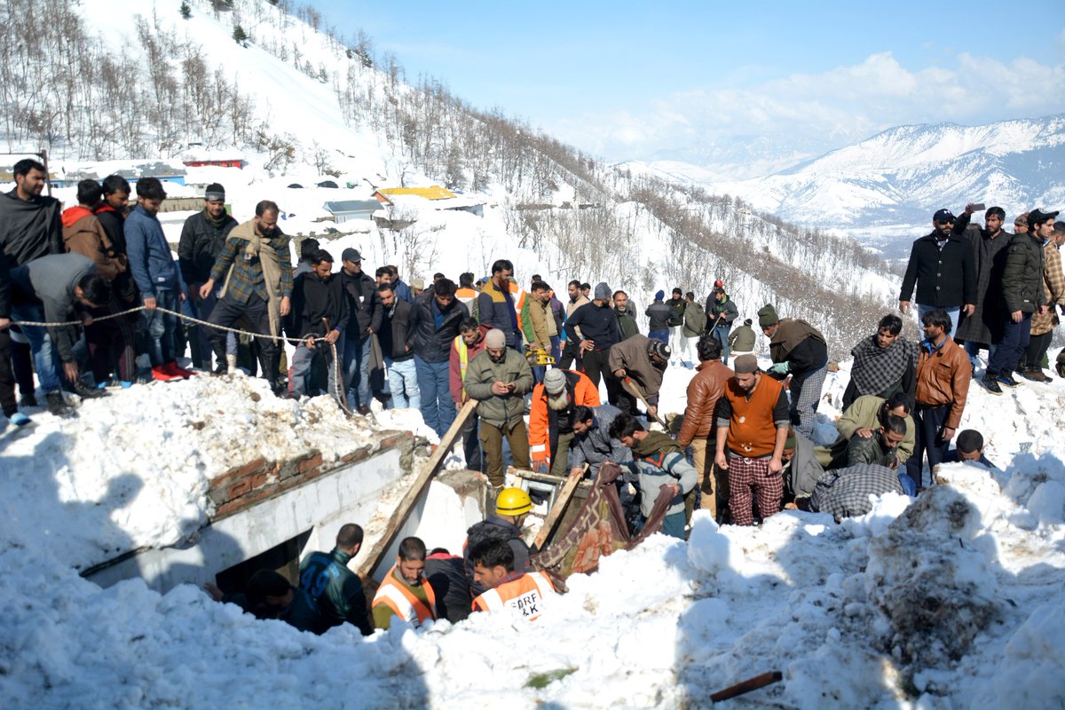 Rescuers search for survivors after a snow avalanche buried a police post near Jawahar Tunnel in Kulgam district of Jammu and Kashmir on Friday.  