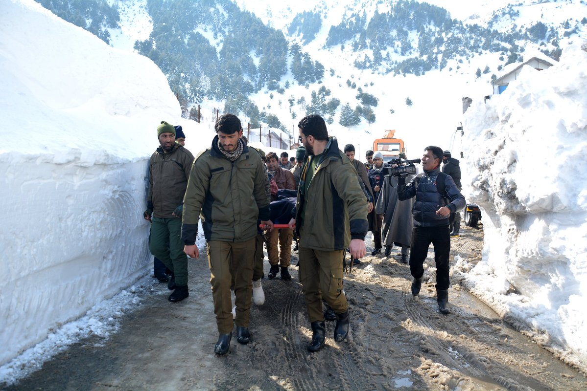 Rescuers search for survivors after a snow avalanche buried a police post near Jawahar Tunnel in Kulgam district of Jammu and Kashmir on Friday.  