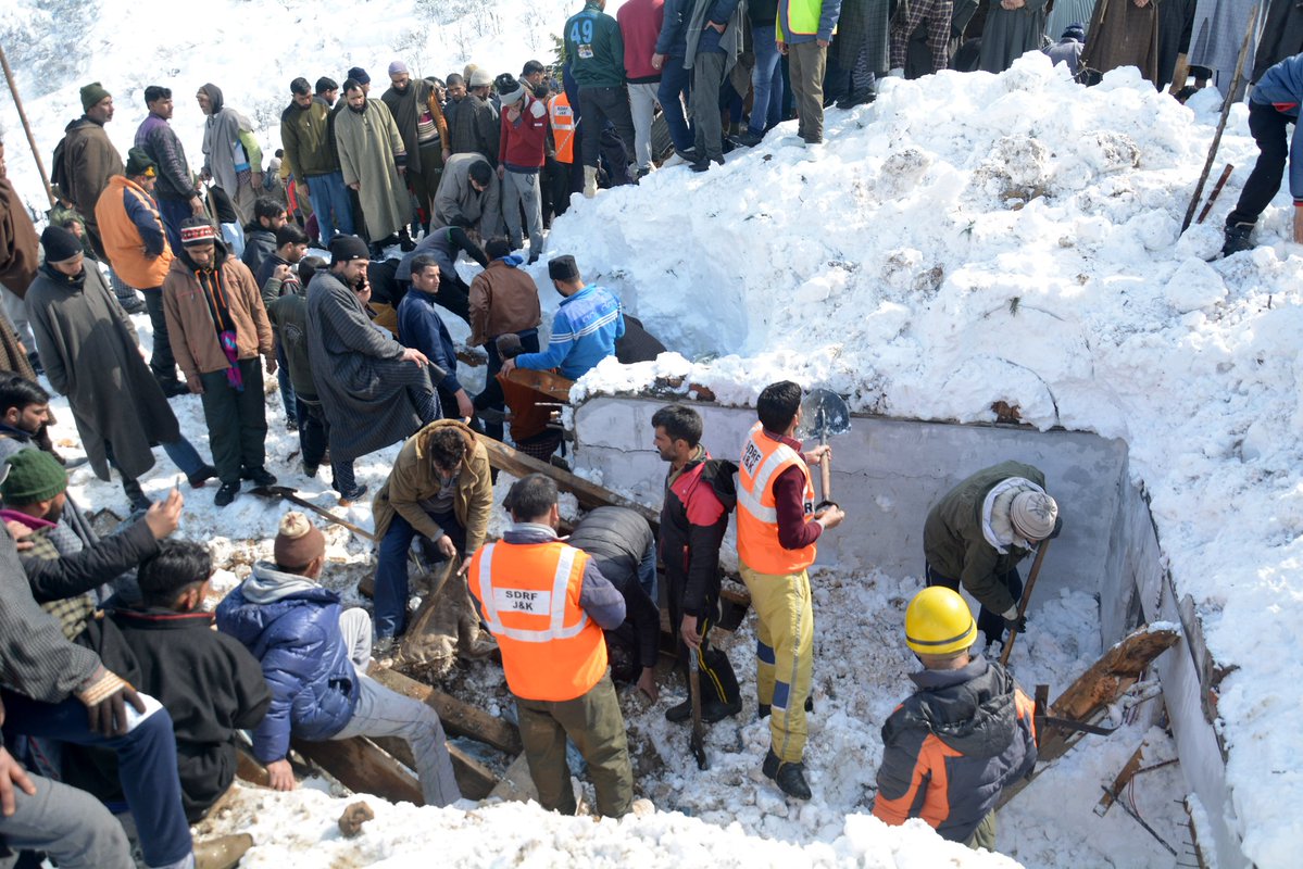 Rescuers search for survivors after a snow avalanche buried a police post near Jawahar Tunnel in Kulgam district of Jammu and Kashmir on Friday.  